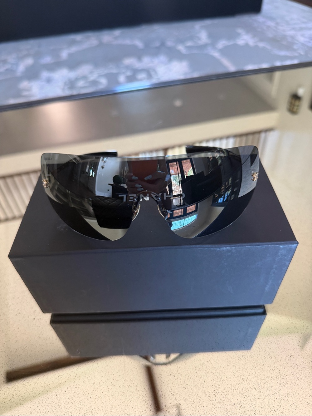 CHANEL Black Shield Sunglasses with Gold Logo Accents